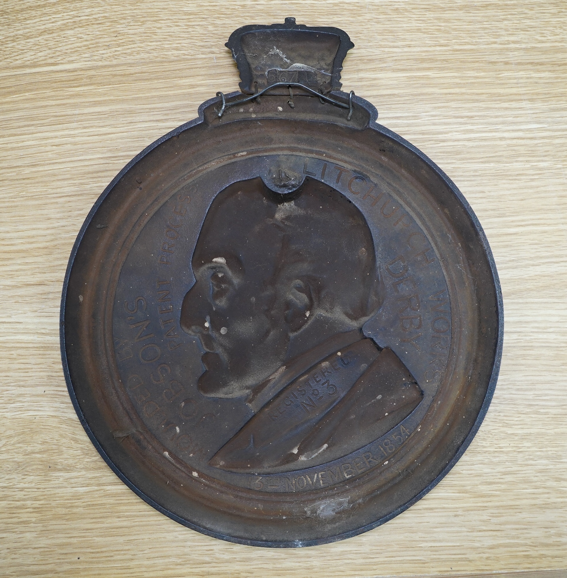 A cast iron profile of the Duke of Wellington, inscribed verso 'Moulded by Jobson's Patent Process, Litchurch, Derby, Registered No. 3, 13th November 1854'. Condition - good